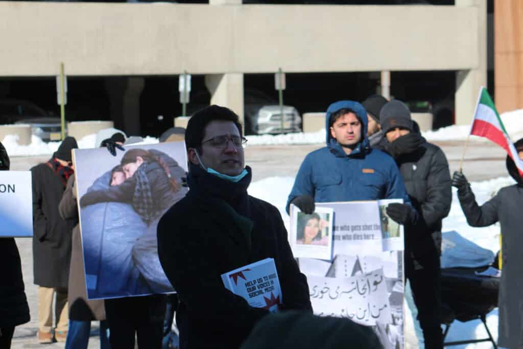 Event organizer speaks to demonstrators